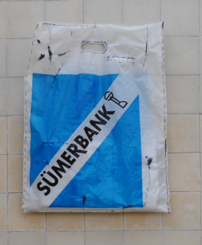 original sumerbank store plastic bag rectangle,in white, bright blue and black text on it, stichted on several points